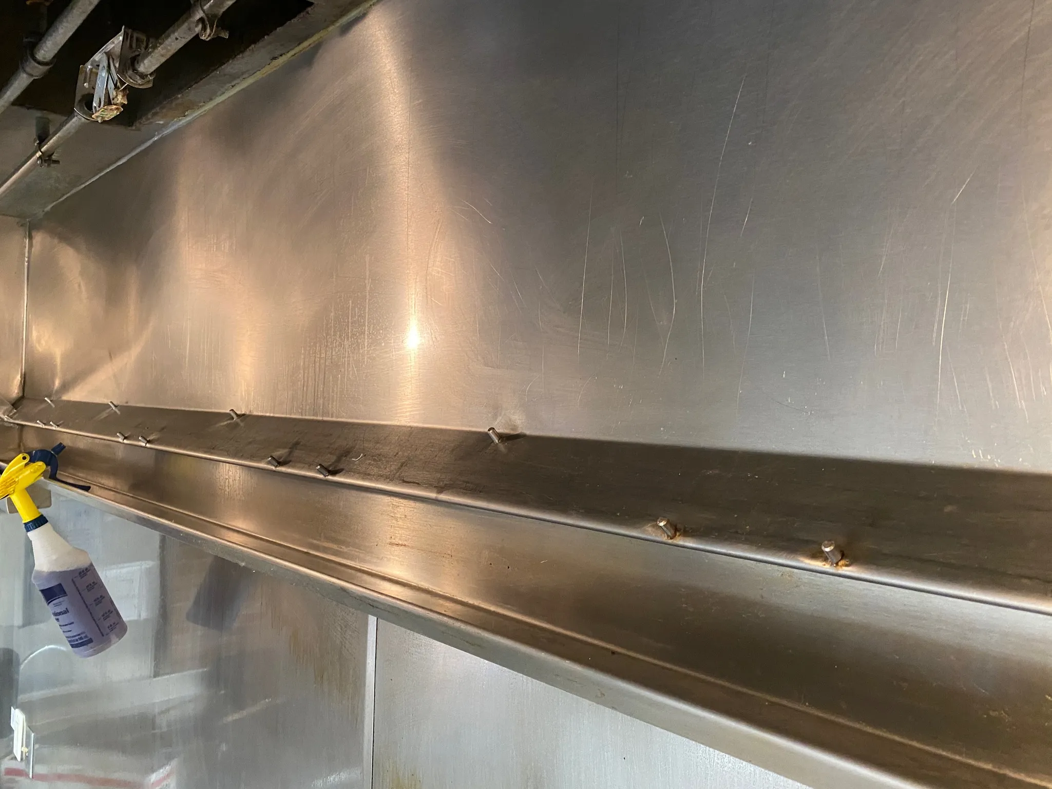 Clean interior of a commercial kitchen hood canopy
